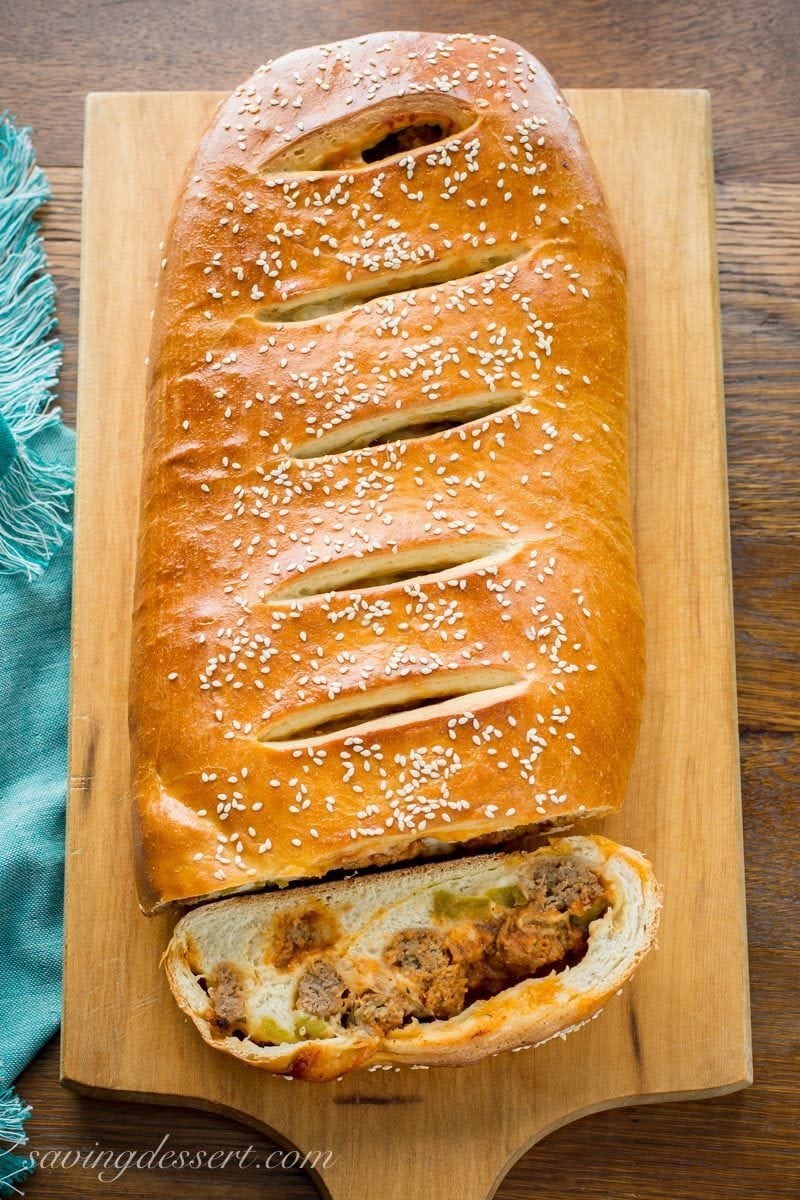 Whole sliced cheesy meatball stromboli