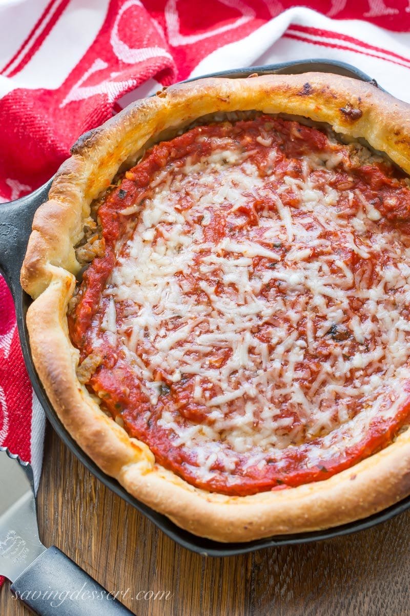 deep-dish sausage pizza Chicago-style in a cast iron skillet