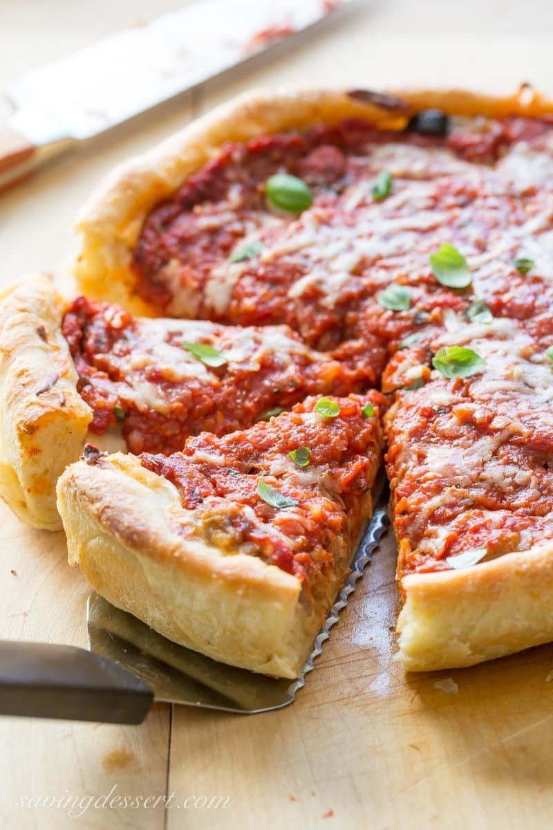 sliced Chicago-style deep-dish pizza on a cutting board