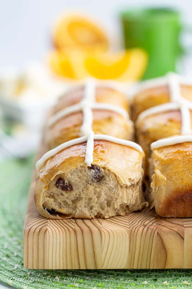 Side view of hot cross buns showing raisins inside