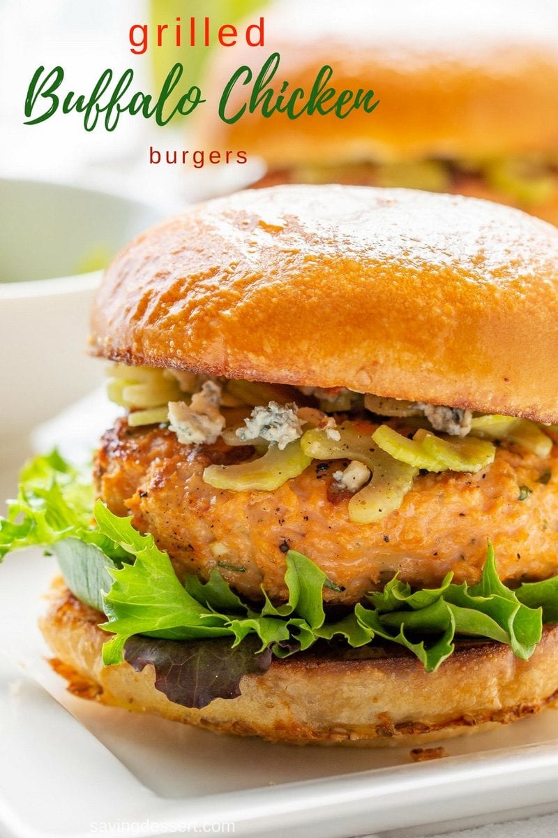 Grilled Buffalo Chicken Burgers with blue cheese and celery topping on a bun