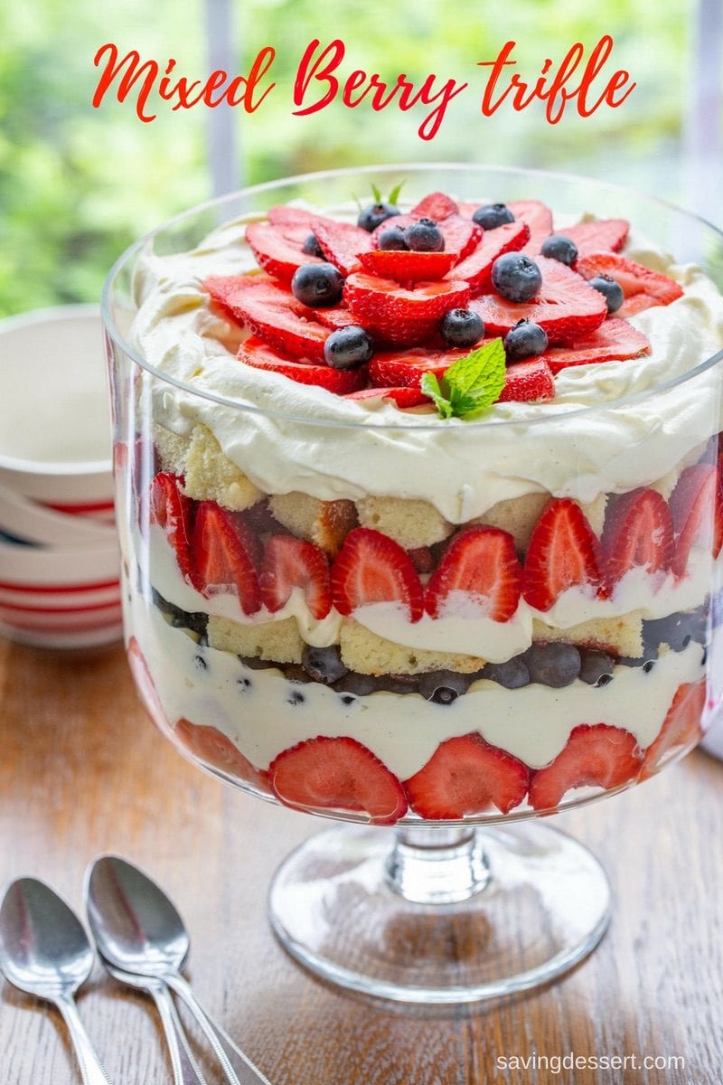 A mixed berry trifle in a trifle bowl with a patriotic theme