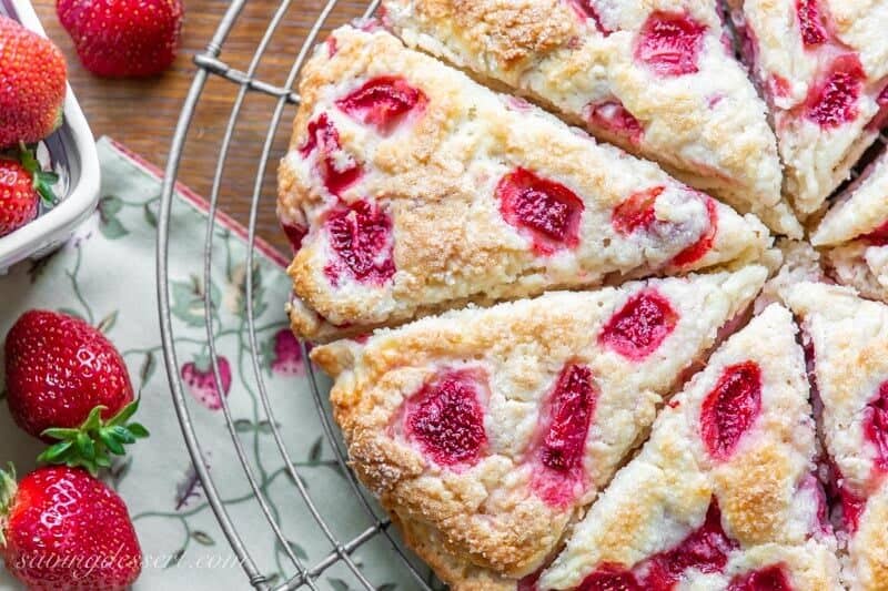 A close up view of strawberry biscuits cut into wedges