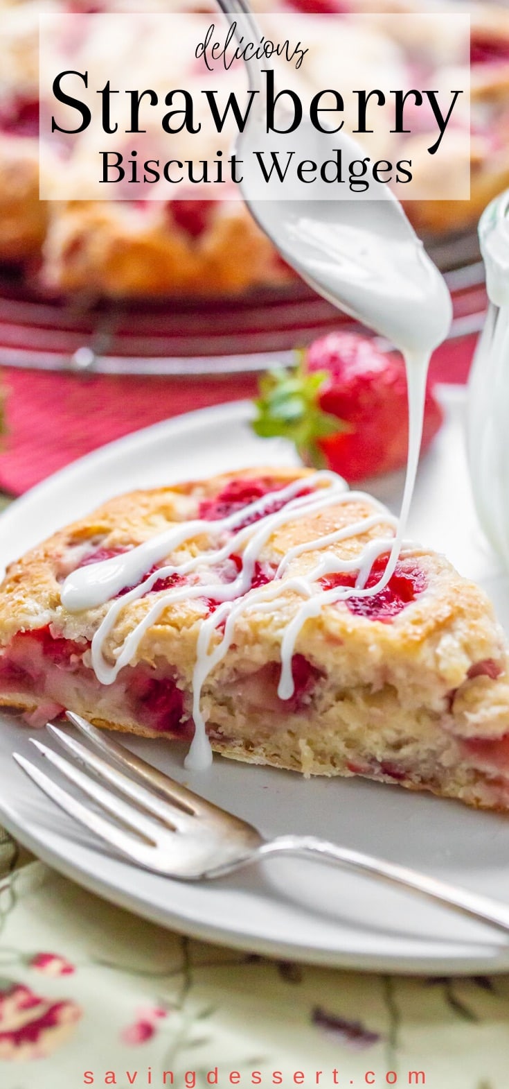 A biscuit wedge filled with chopped strawberries being drizzled with a simple icing