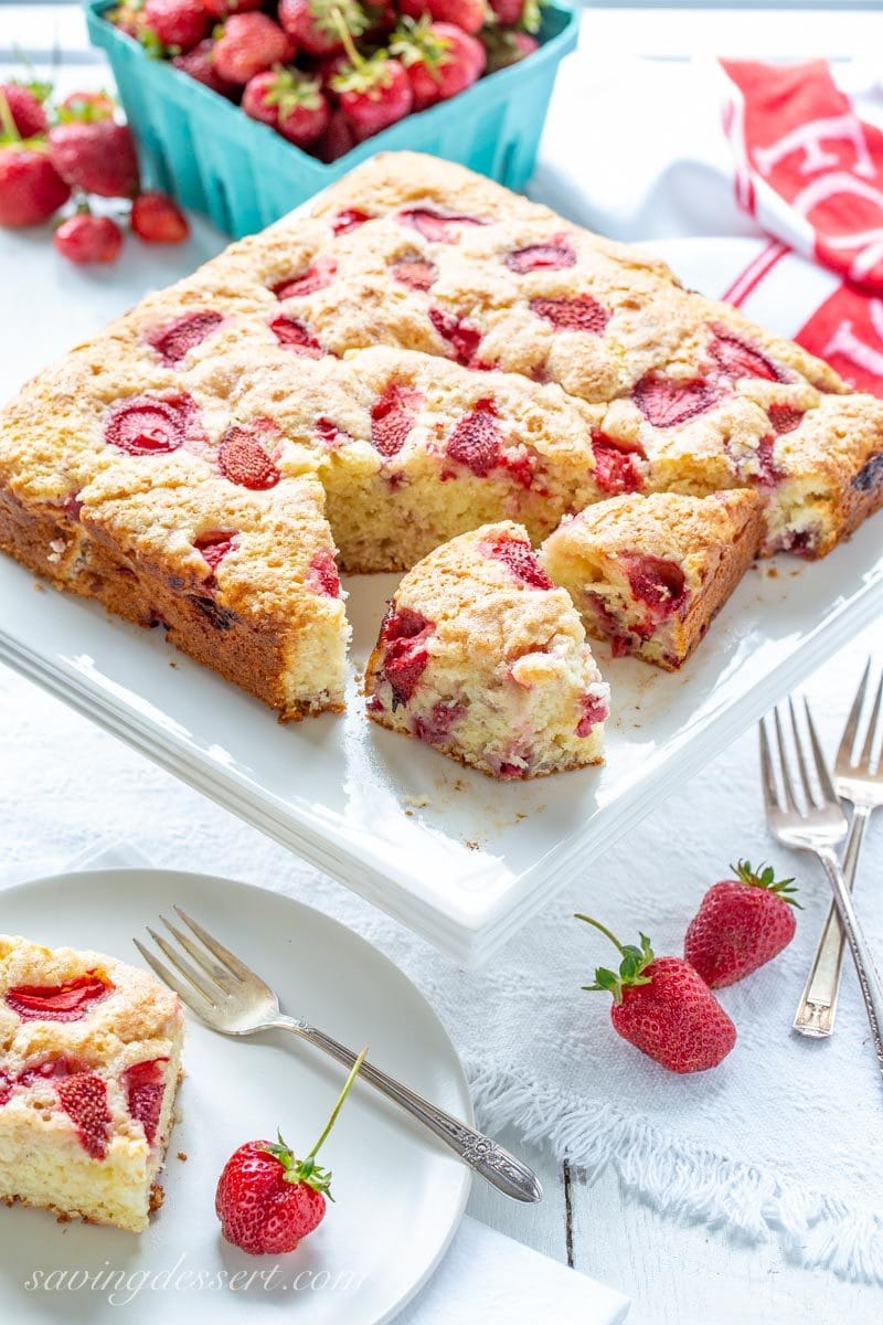 Strawberry Breakfast Cake with fresh strawberries on a cake stand