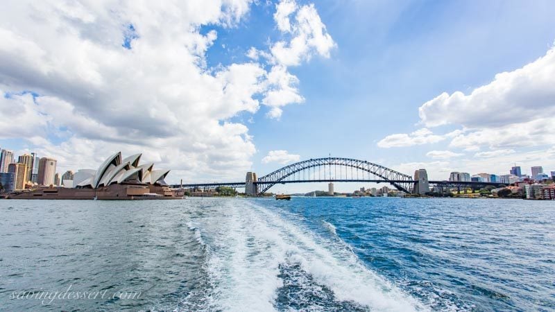 A look back from the ferry toward downtown, the Sydney Opera House and the Sydney Harbour Bridge.