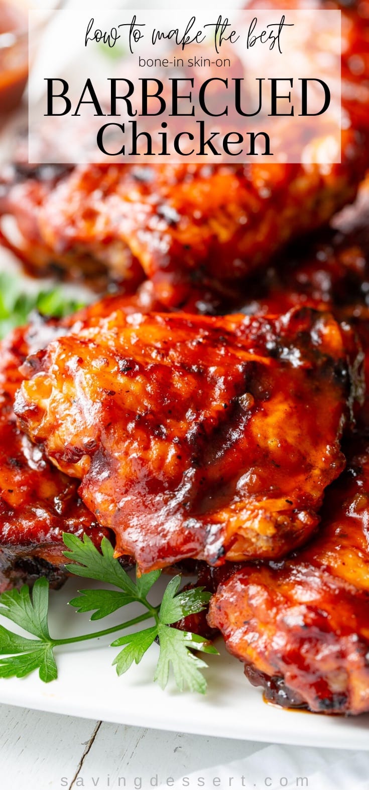 A platter of barbecued chicken pieces slathered in BBQ sauce