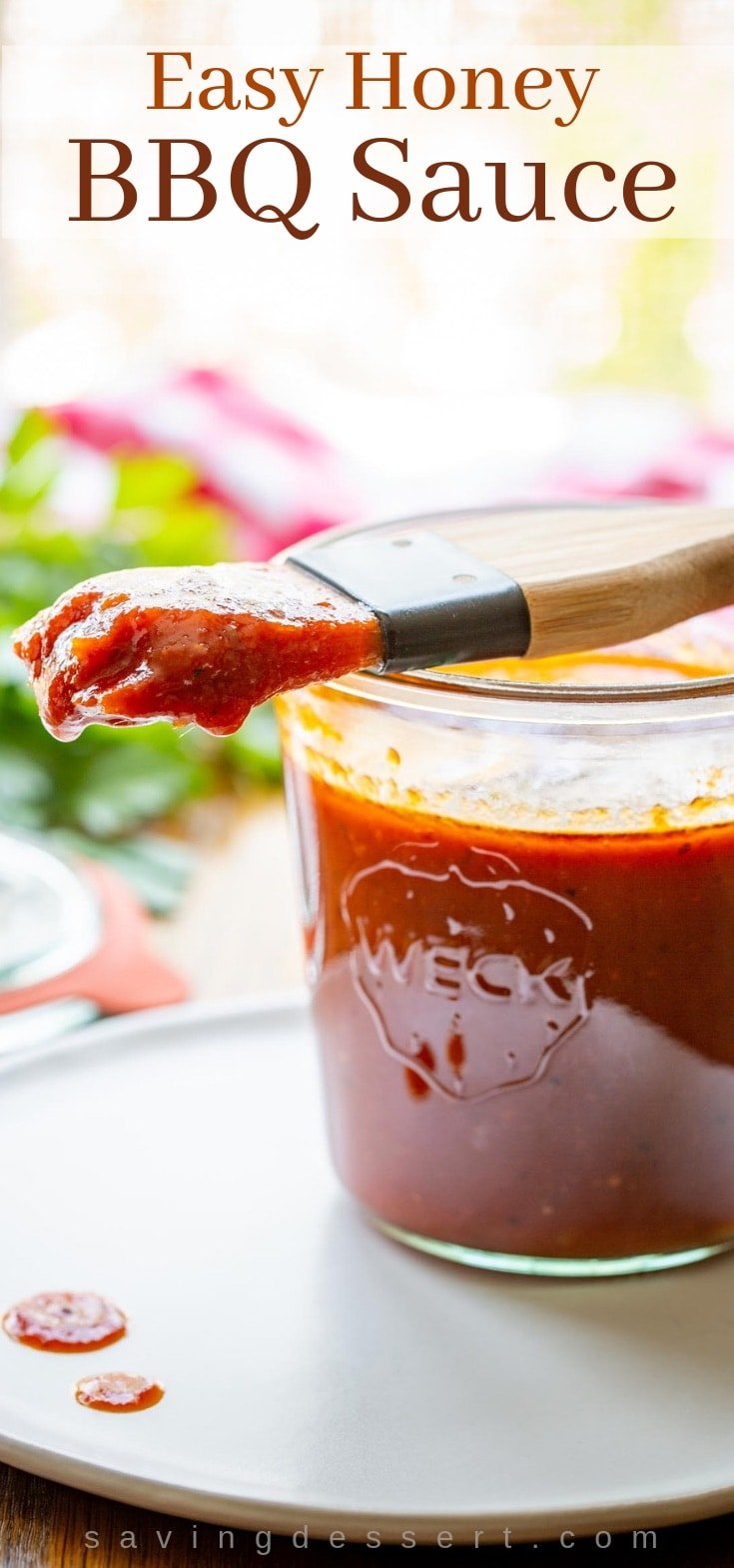 A jar of honey BBQ sauce with a brush for slathering