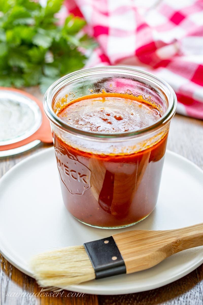 A jar of BBQ sauce on a plate