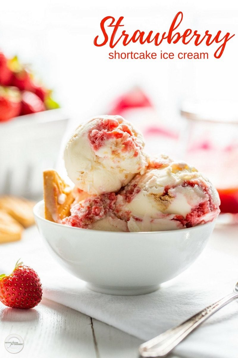 A bowl of strawberry shortcake ice cream with fresh strawberry and shortbread cookies crumbled throughout