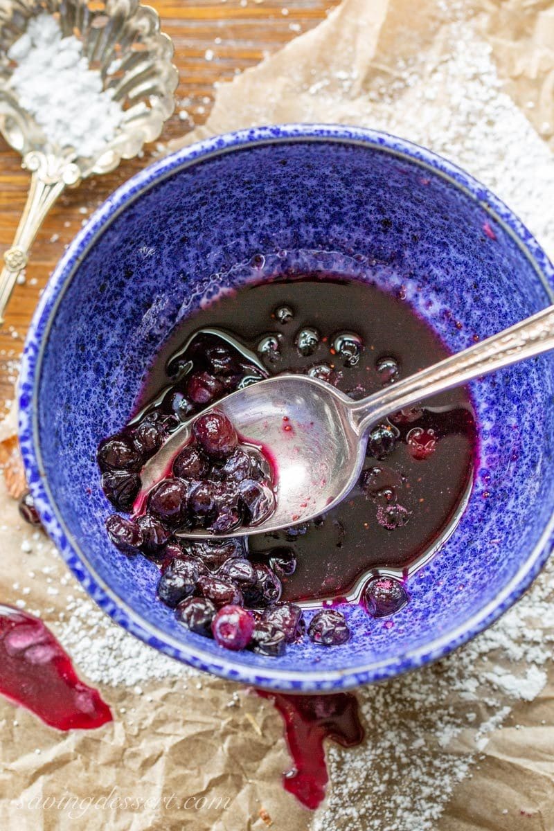 a bowl of blueberries and honey infused syrup