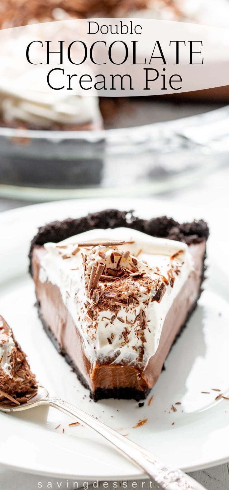 A slice of chocolate cream pie with a chocolate crust and topped with shaved chocolate and whipped cream