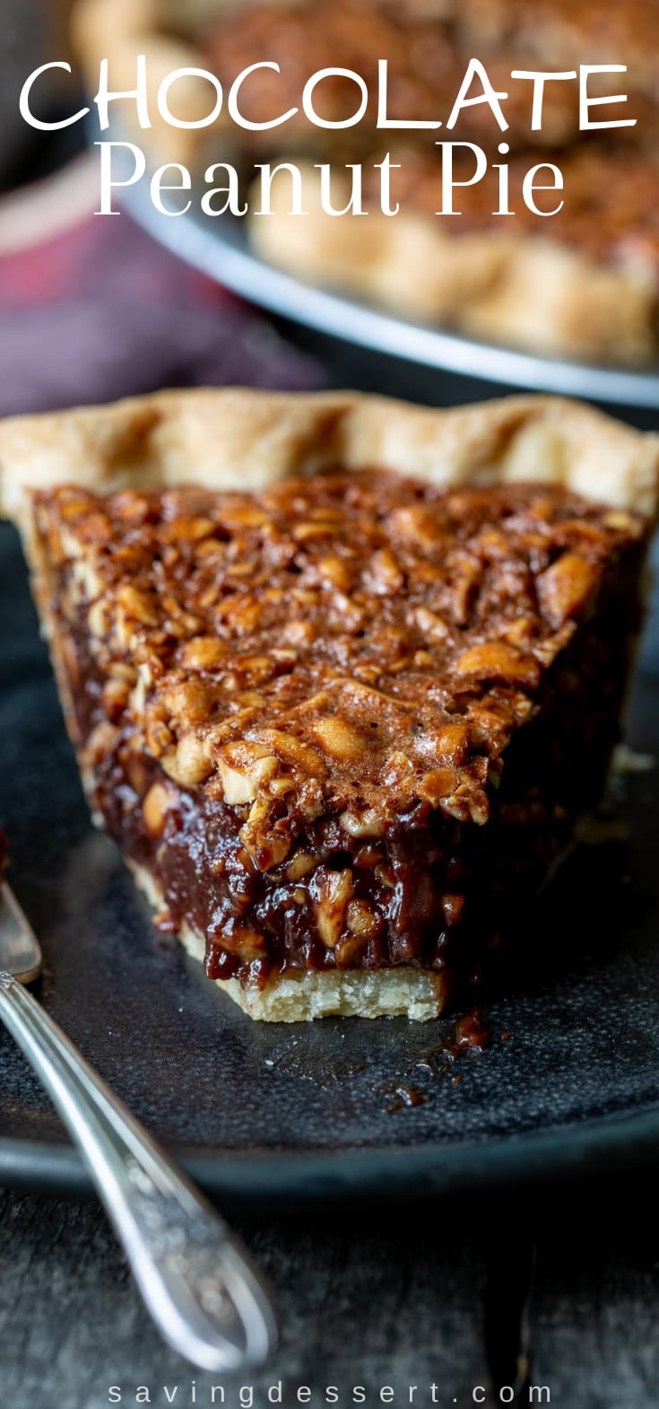 A slice of chocolate peanut pie on a black plate