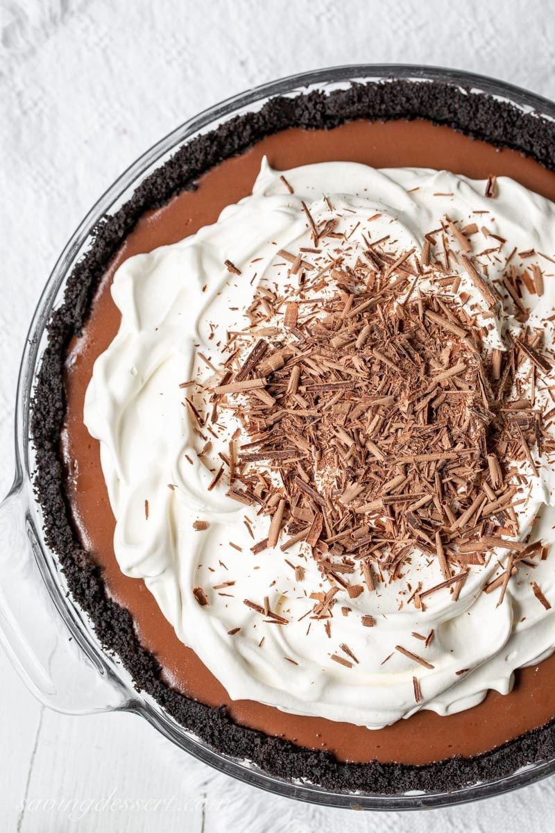 Double Chocolate Cream Pie with a chocolate cookie crumb crust, whipped cream and chocolate shavings on top