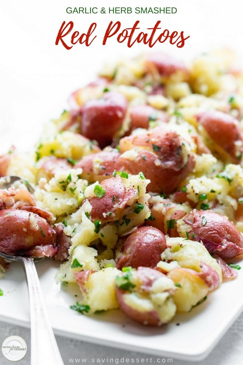 Garlic & Herb Smashed Red Potatoes - an easy and filling side dish with plenty of flavor from the garlic, green onions and fresh parsley - and butter too! #savingroomfordessert #smashedpotatoes #crushedpotatoes #potatoes #mashedpotatoes #redpotatoes #sidedish #vegetablesidedish