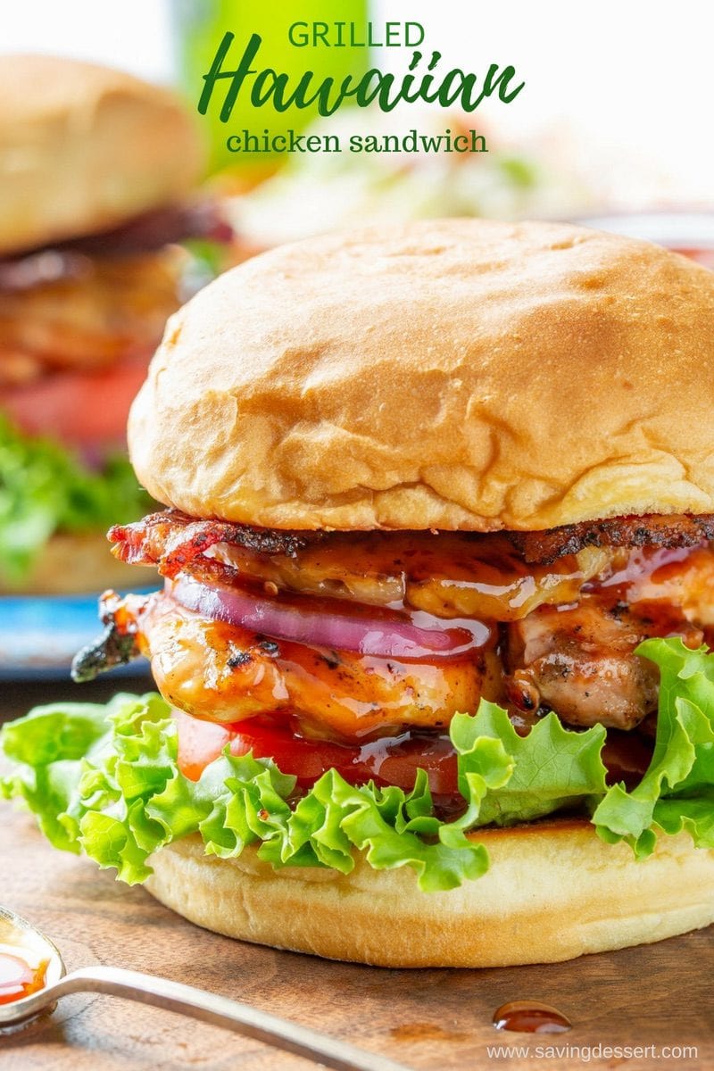 A closeup of a Hawaiian Chicken Sandwich with pineapple and BBQ sauce