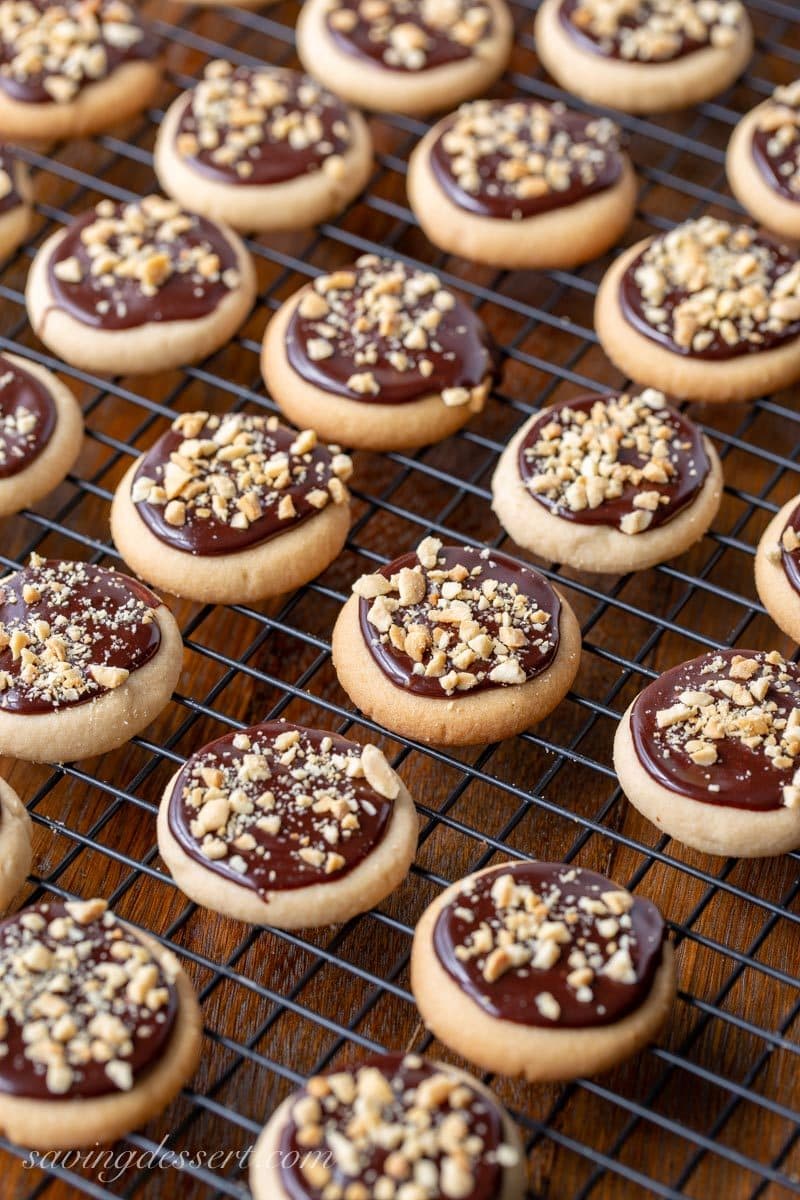 Peanut Butter Meltaway Cookies with a chocolate glaze and crushed peanuts on top
