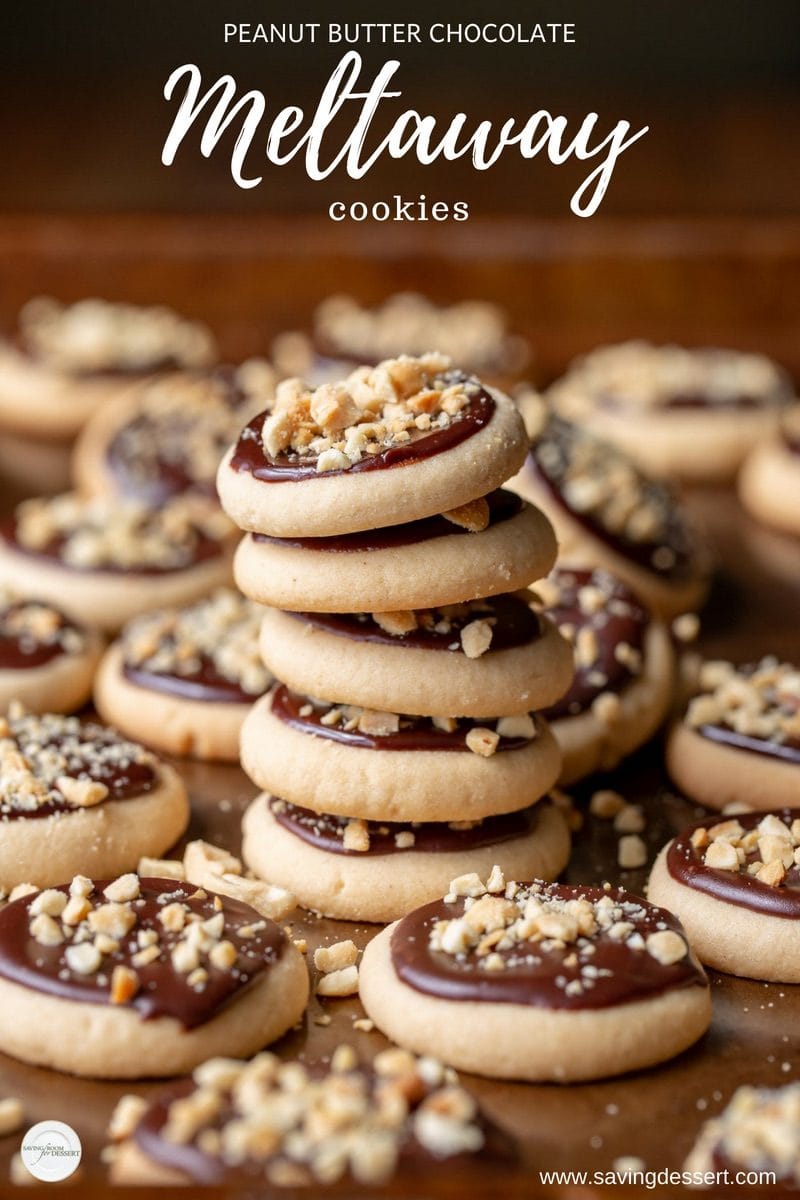 A stack of peanut butter chocolate meltaway cookies with crushed peanuts on top