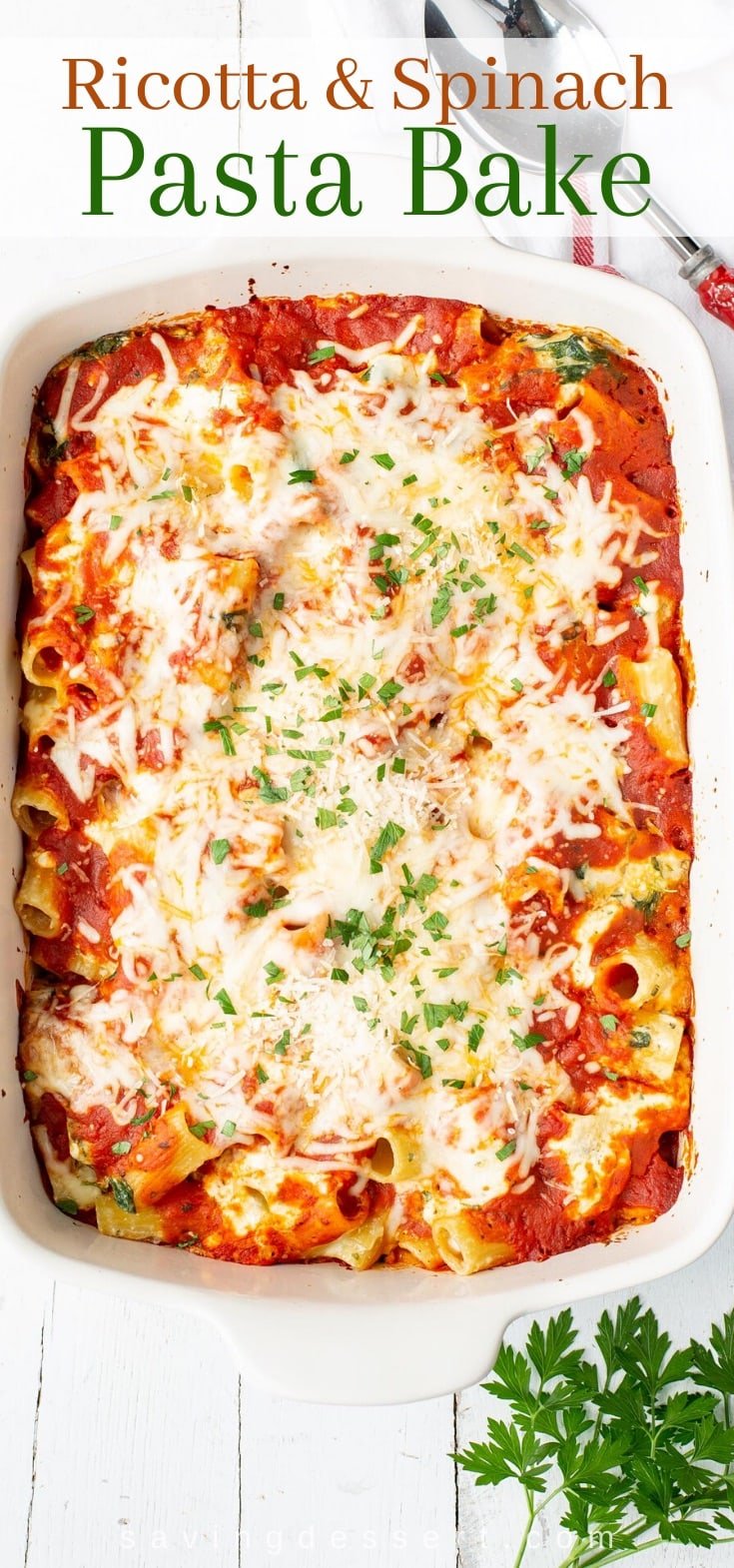A casserole filled with a ricotta pasta and spinach recipe topped with cheese