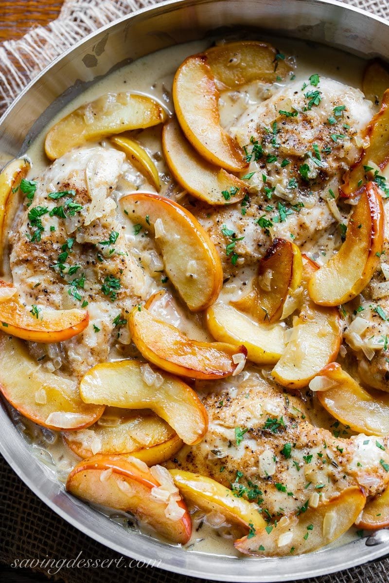 Chicken Fricassee with apples in a skillet