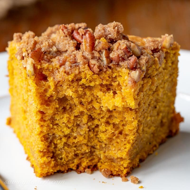 A closeup of a partially eaten slice of Pumpkin Breakfast Cake on a plate