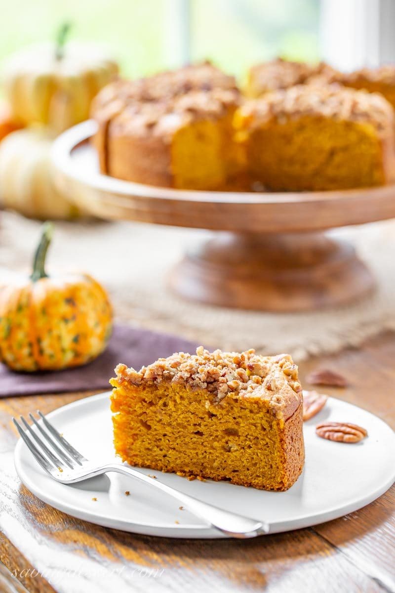 A slice of Pumpkin Breakfast Cake topped with a sweet Pecan Crumble