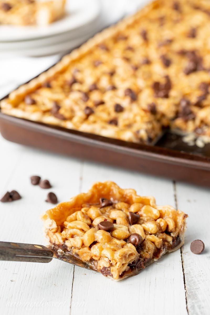 A slice of Ultra-Nutty Chocolate Peanut Slab Pie with chocolate chips