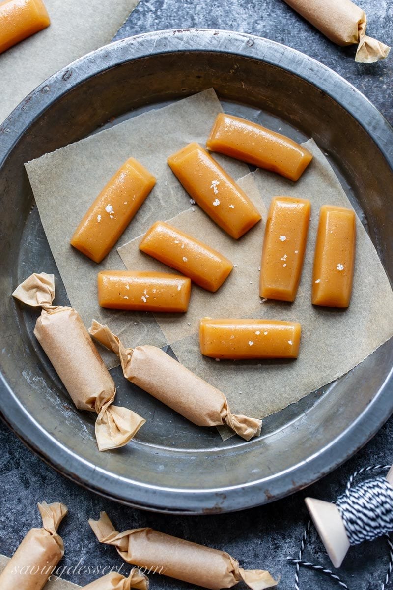 A pan of apple cider caramels sprinkled with flaky sea salt