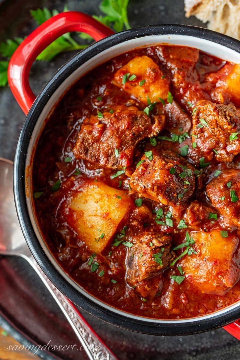 A bowl of chunky Hungarian style beef goulash with parsley