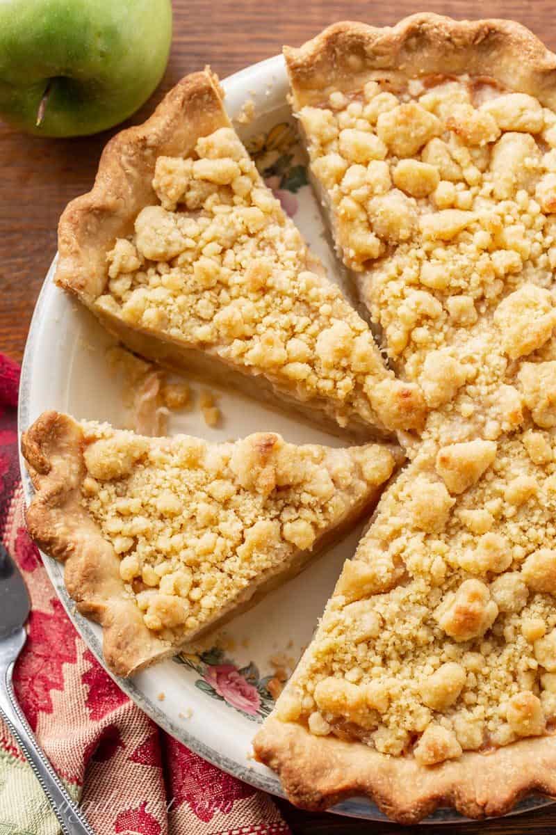A sliced Dutch apple pie with streusel topping