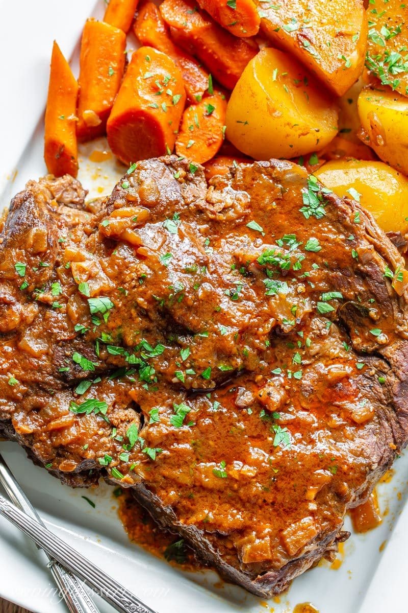 a juicy, tender and flavorful oven-braised pot roast with carrots and potatoes