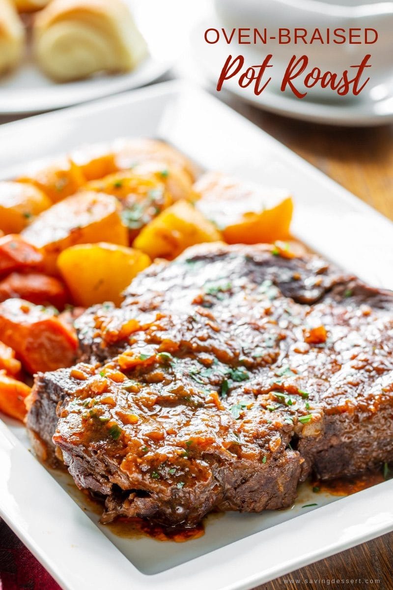 A platter with an oven-braised pot roast, carrots and potatoes