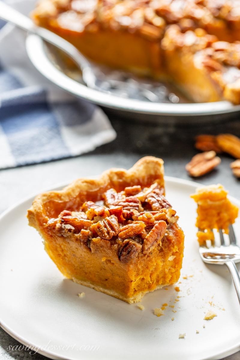 A slice of sweet potato pie with a praline pecan topping