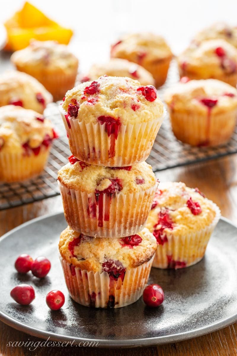 A stack of moist orange and cranberry muffins