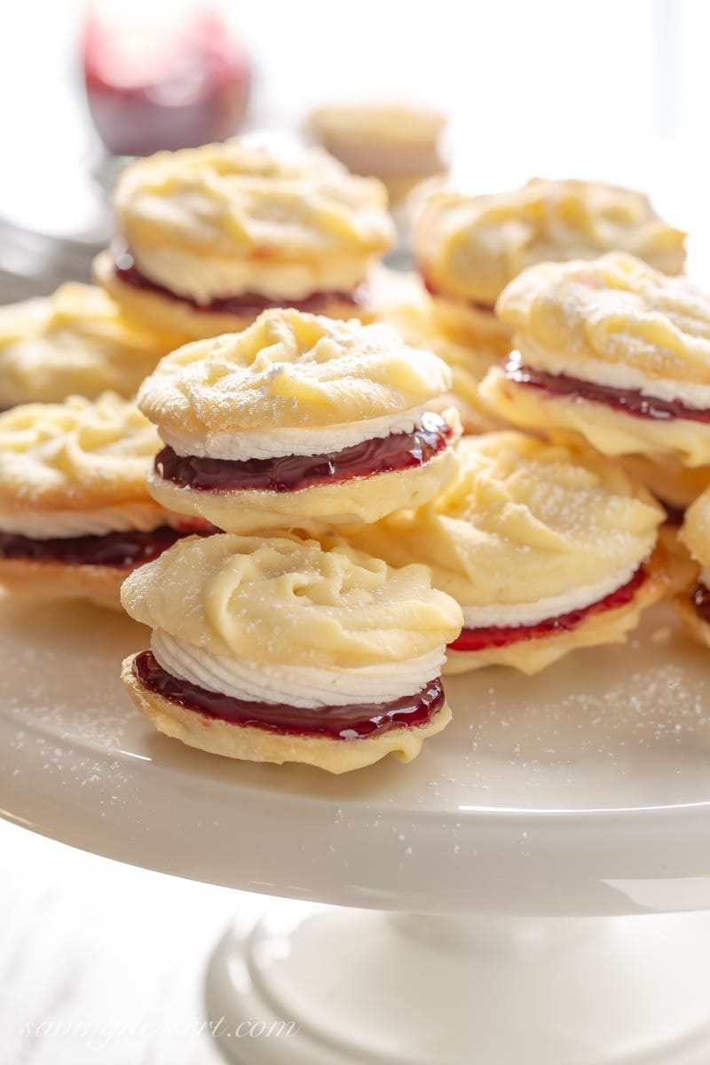 A stack of Viennese Whirls with raspberry jam