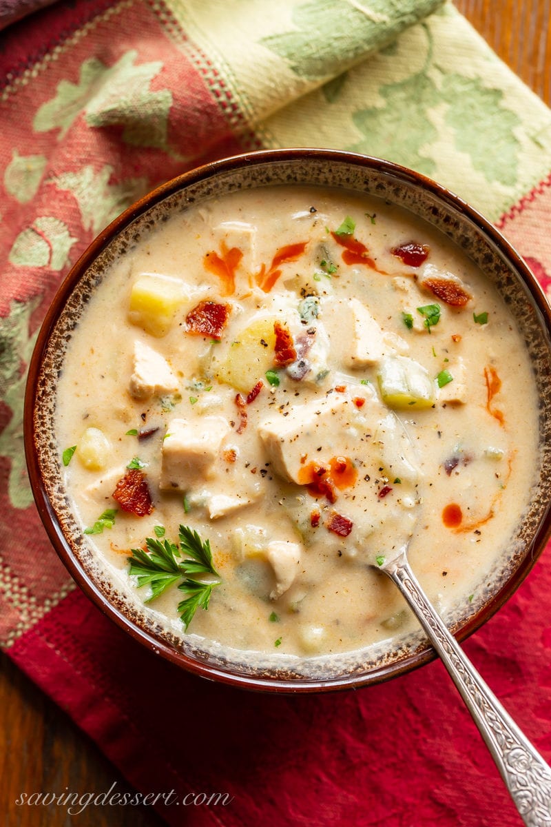 A bowl of Buffalo Chicken Chowder with bacon and potatoes