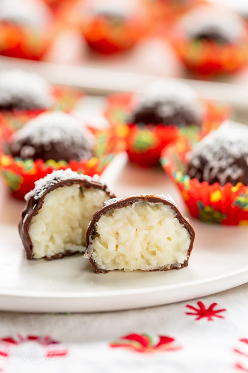 A chocolate covered coconut ball cut in half revealing the creamy center