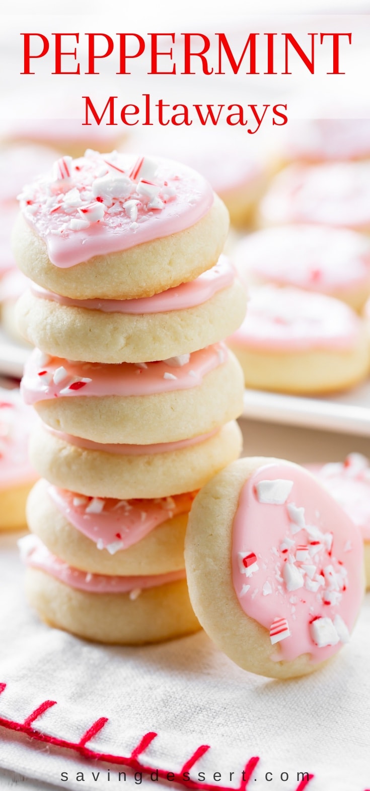 A stack of peppermint meltaway cookies topped with crushed peppermints
