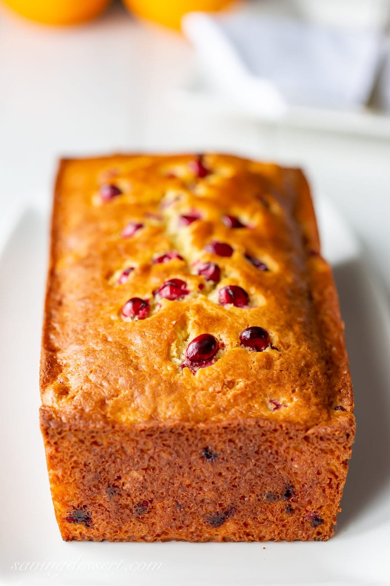 A golden loaf of Cranberry Orange Bread