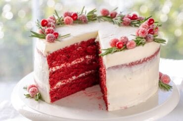 A sliced Red Velvet Cake on a cake stand