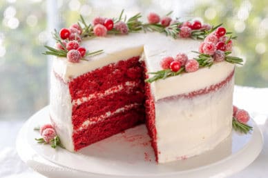 A sliced Red Velvet Cake on a cake stand