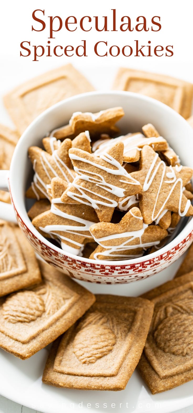 A bowl of spiced star cookies topped with a drizzle of icing