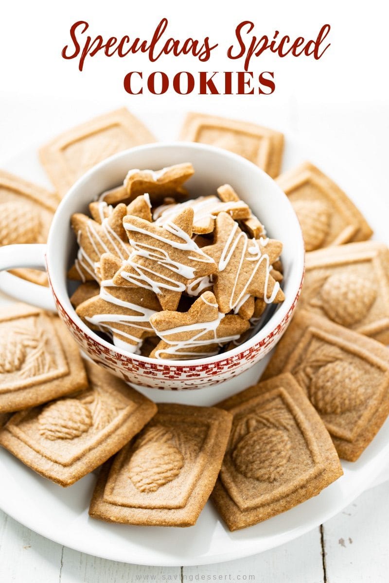 An overhead view of a bowl of star shaped cookies drizzled with icing