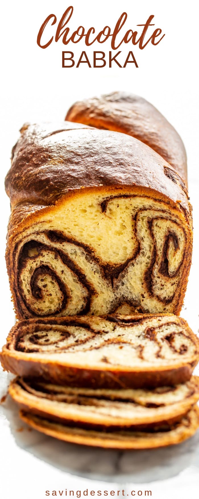 A loaf of chocolate babka sliced showing swirls