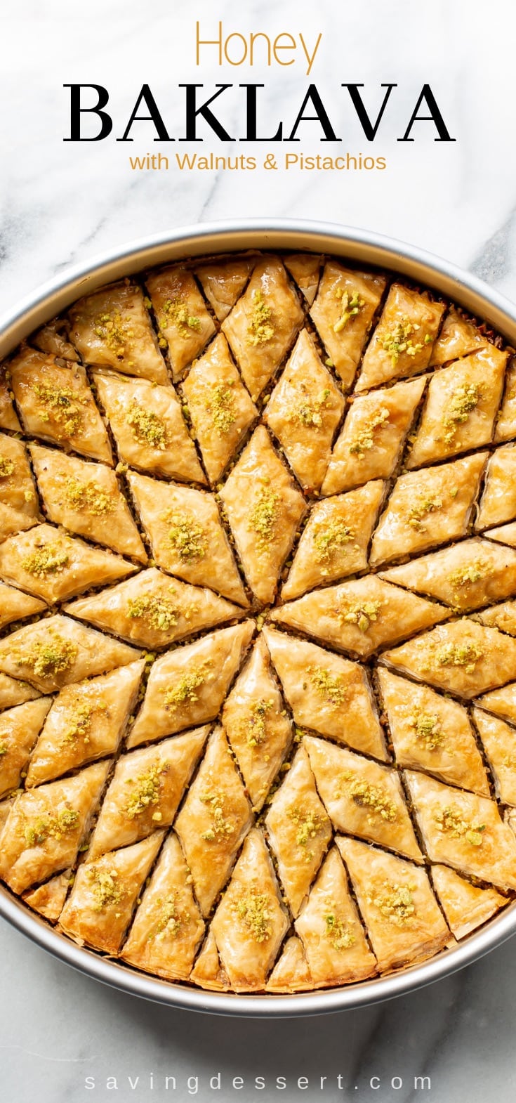 Honey Baklava Recipe with Walnuts and Pistachios - layers and layers of flaky phyllo slathered with melted butter, honey and loads of nuts - who can resist a slice of this delicious Honey Baklava Recipe #baklava #honeybaklava #pistachiobaklava #walnutbaklava #Greekbaklava #honey #dessert