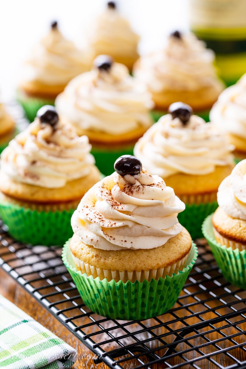 Vanilla coffee cupcakes with a swirled icing topped with an espresso bean