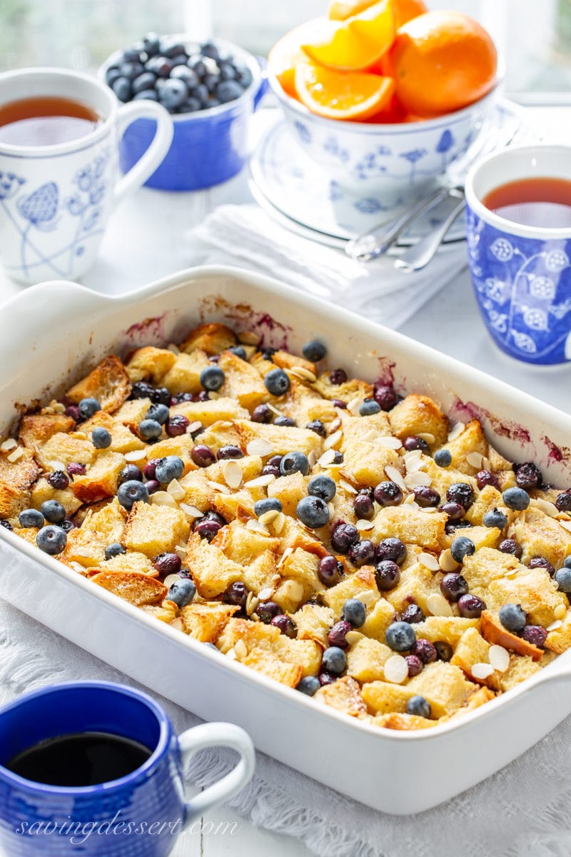 A Blueberry Overnight French Toast Casserole served with tea and oranges