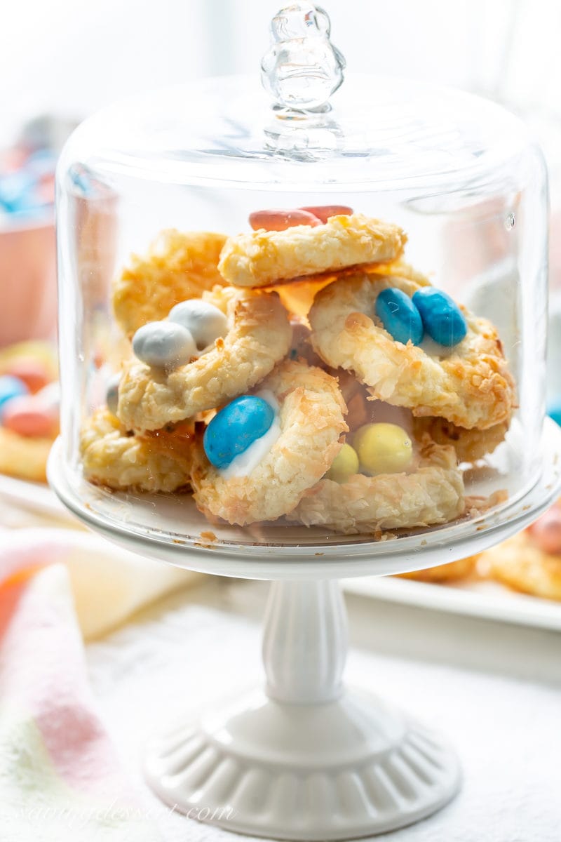 Coconut Thumbprint Cookies on a mini cake stand