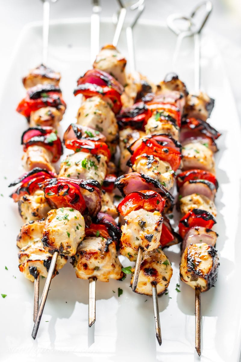 Grilled Greek Chicken skewers with red onion and red peppers