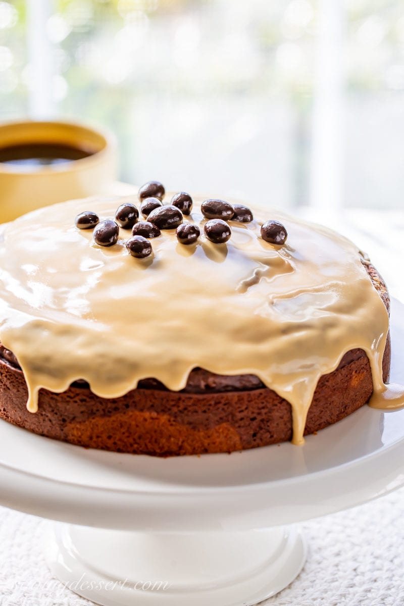 An Irish Cream Breakfast Cake with a spirited coffee flavored glaze garnished with espresso beans